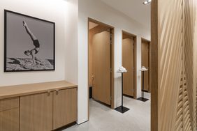 Upper floor with fitting rooms, a framed photograph and oak joinery